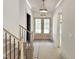 Hallway with natural light and front door access at 7208 Tanbark Way, Raleigh, NC 27615