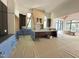Bright, spacious kitchen with ample natural light, an unfinished stone fireplace, and a large center island at 7208 Tanbark Way, Raleigh, NC 27615