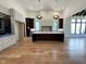 Open kitchen design with a central island, hardwood floors, high ceilings, a pendant lights, and lots of natural light at 7208 Tanbark Way, Raleigh, NC 27615