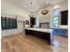 Bright, open kitchen with a large island, hardwood floors, lots of cabinet space, and plenty of natural light at 7208 Tanbark Way, Raleigh, NC 27615