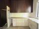 Elegant kitchen area with custom cabinetry, ample counter space, and modern design elements at 7208 Tanbark Way, Raleigh, NC 27615
