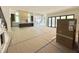 Bright and airy living space with open floor plan, modern staircase, and expansive sliding glass doors at 7208 Tanbark Way, Raleigh, NC 27615