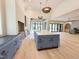 Open-concept living space with hardwood floors and ample natural light at 7208 Tanbark Way, Raleigh, NC 27615