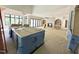Spacious living room with large windows, a fireplace, and open access to other living areas at 7208 Tanbark Way, Raleigh, NC 27615