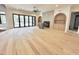 Spacious living room with hardwood floors, fireplace, and views of the backyard at 7208 Tanbark Way, Raleigh, NC 27615