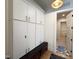 This mudroom includes a bench with storage, lockers and access to other parts of the house at 7208 Tanbark Way, Raleigh, NC 27615