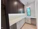 Spacious mudroom featuring storage cabinets, ample counter space, and modern design at 7208 Tanbark Way, Raleigh, NC 27615