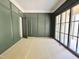 Stylish office with decorative wall paneling, and large windows at 7208 Tanbark Way, Raleigh, NC 27615
