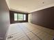 Spacious room with large windows and ample natural light ready for paint at 7208 Tanbark Way, Raleigh, NC 27615