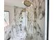 Close-up of marble shower area with dual shower heads and detailed tile work at 7208 Tanbark Way, Raleigh, NC 27615