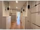 Large walk-in closet with hardwood floors, built in shelving, and plenty of storage space at 7208 Tanbark Way, Raleigh, NC 27615
