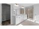 Modern bathroom featuring double sink vanity, walk in shower, and walk-in closet at 100 Bold Dr, Youngsville, NC 27596