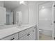 This bathroom features a white vanity with black hardware and a bright white tub and shower at 100 Bold Dr, Youngsville, NC 27596
