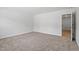 This bedroom features neutral carpeting and white trim throughout for a clean look at 100 Bold Dr, Youngsville, NC 27596