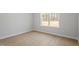 Bright bedroom with hardwood floors and a large window at 100 Bold Dr, Youngsville, NC 27596