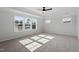Well-lit bedroom with large windows and cozy carpet at 100 Bold Dr, Youngsville, NC 27596