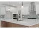 Modern kitchen featuring white cabinets, stainless steel appliances, and center island at 100 Bold Dr, Youngsville, NC 27596