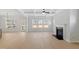 Bright living room with light wood floors, fireplace and coffered ceilings at 100 Bold Dr, Youngsville, NC 27596