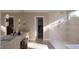 Bright bathroom features stone flooring, double vanities, and a walk-in shower at 126 Harvest Ln, Pittsboro, NC 27312