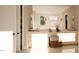 Bright bathroom features stone flooring, double vanities, and modern fixtures at 126 Harvest Ln, Pittsboro, NC 27312