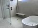 Modern bathroom with walk-in shower, soaking tub, and sleek fixtures at 126 Harvest Ln, Pittsboro, NC 27312