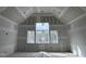 Bedroom under construction with three large windows allowing natural light and tall ceilings at 126 Harvest Ln, Pittsboro, NC 27312