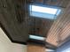 Contemporary ceiling with dark wood panels and skylights, adding architectural interest and natural light at 126 Harvest Ln, Pittsboro, NC 27312