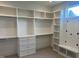 Walk-in closet with custom shelving, drawers, and ample storage space at 126 Harvest Ln, Pittsboro, NC 27312