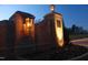 Elegant brick entrance to community featuring a decorative lantern at twilight at 126 Harvest Ln, Pittsboro, NC 27312