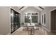 Bright dining room features a vaulted ceiling, hardwood floors, and sliding glass door to the outside at 126 Harvest Ln, Pittsboro, NC 27312