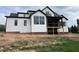 New construction home featuring white siding, black trim, and a covered porch under construction at 126 Harvest Ln, Pittsboro, NC 27312
