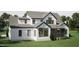 Rear exterior view with white siding and expansive windows, offering abundant natural light at 126 Harvest Ln, Pittsboro, NC 27312