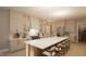 Stunning kitchen features a large island with chairs, modern appliances, and pendant lighting at 126 Harvest Ln, Pittsboro, NC 27312