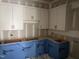 White cabinets with modern black hardware await countertops in the unfinished kitchen space at 126 Harvest Ln, Pittsboro, NC 27312