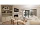 Elegant living room features a cozy fireplace, built-in shelving, and stylish decor at 126 Harvest Ln, Pittsboro, NC 27312