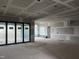 Spacious living room with large windows, drywall and access to the outdoors through sliding doors at 126 Harvest Ln, Pittsboro, NC 27312