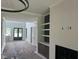 Open concept living area with fireplace and built in shelving for seamless entertaining and relaxation at 126 Harvest Ln, Pittsboro, NC 27312