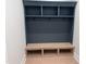 Mudroom with built-in shelving, hooks, and a bench for convenient storage at 126 Harvest Ln, Pittsboro, NC 27312
