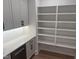 Pantry with white shelving, cabinets and subway tile backsplash providing ample storage space at 126 Harvest Ln, Pittsboro, NC 27312