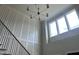 Bright staircase with modern railing and a large window for natural light at 126 Harvest Ln, Pittsboro, NC 27312