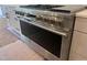 Close up of a stainless steel oven range with matching knobs and accents in kitchen at 126 Harvest Ln, Pittsboro, NC 27312