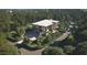 Luxury home nestled on a wooded lot with circular driveway and landscaping at 5909 Tower Grove Dr, Raleigh, NC 27614