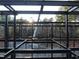 Metal framing reveals the infrastructure of the property, set against the backdrop of trees and construction equipment at 5909 Tower Grove Dr, Raleigh, NC 27614