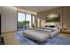 Bright main bedroom featuring a private balcony, wood accents and minimalist modern design elements at 5909 Tower Grove Dr, Raleigh, NC 27614