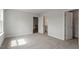 Bedroom featuring carpet, neutral walls, and multiple doorways for easy access to other areas at 90 Bold Dr, Youngsville, NC 27596