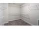 Walk-in closet with carpet and white wire shelving installed at 90 Bold Dr, Youngsville, NC 27596
