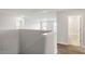 Hallway featuring wood-look floors, neutral walls, and an entrance to a bathroom and another room at 90 Bold Dr, Youngsville, NC 27596
