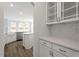 Kitchen featuring stainless steel appliances, island, tile backsplash, and white cabinets and countertops at 90 Bold Dr, Youngsville, NC 27596