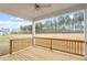 Outdoor porch area overlooking a spacious lawn surrounded by lush trees under sunny skies at 90 Bold Dr, Youngsville, NC 27596