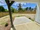 Expansive backyard, enclosed by a wooden fence, with a concrete patio and emerging spring foliage at 247 Jenkins St, Erwin, NC 28334